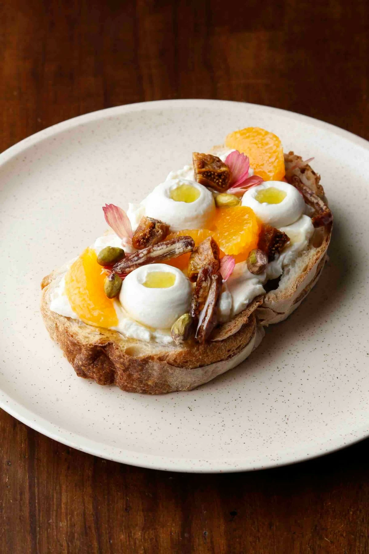 RICOTTA TOAST Mediterranean Toast with whipped ricotta, dates, figs, pistachios, and orange blossom oil, served as part of the restaurant’s all-day breakfast menu. (Photo: Flour Pot Bistro and Bakery)