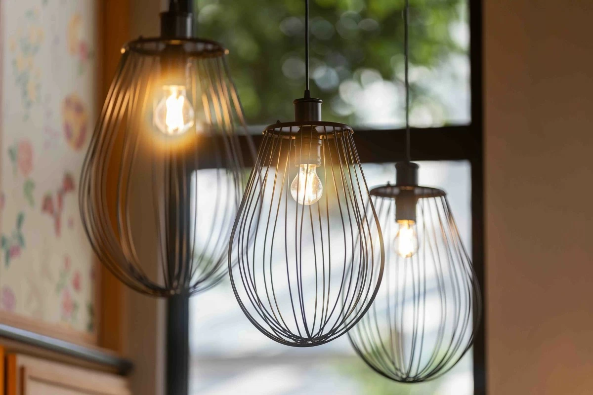 WHISK LIGHTS Whisk-shaped pendant fixtures hang above the dining space, a playful nod to the kitchen’s pastry roots. (Photo: Flour Pot Bistro and Bakery)