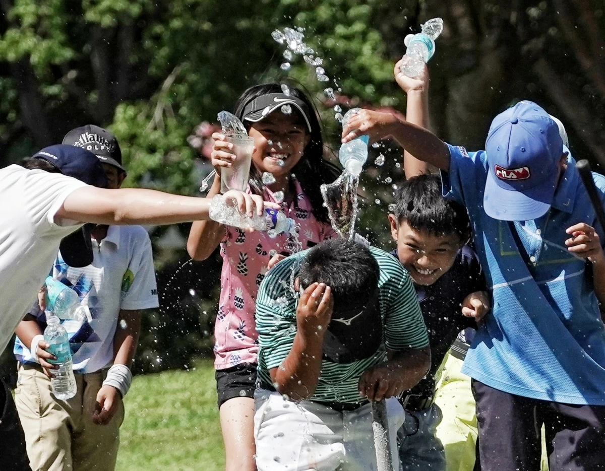 Stephen Clementer is drenched by fellow players in celebration after completing a thrilling comeback victory. (PGT)