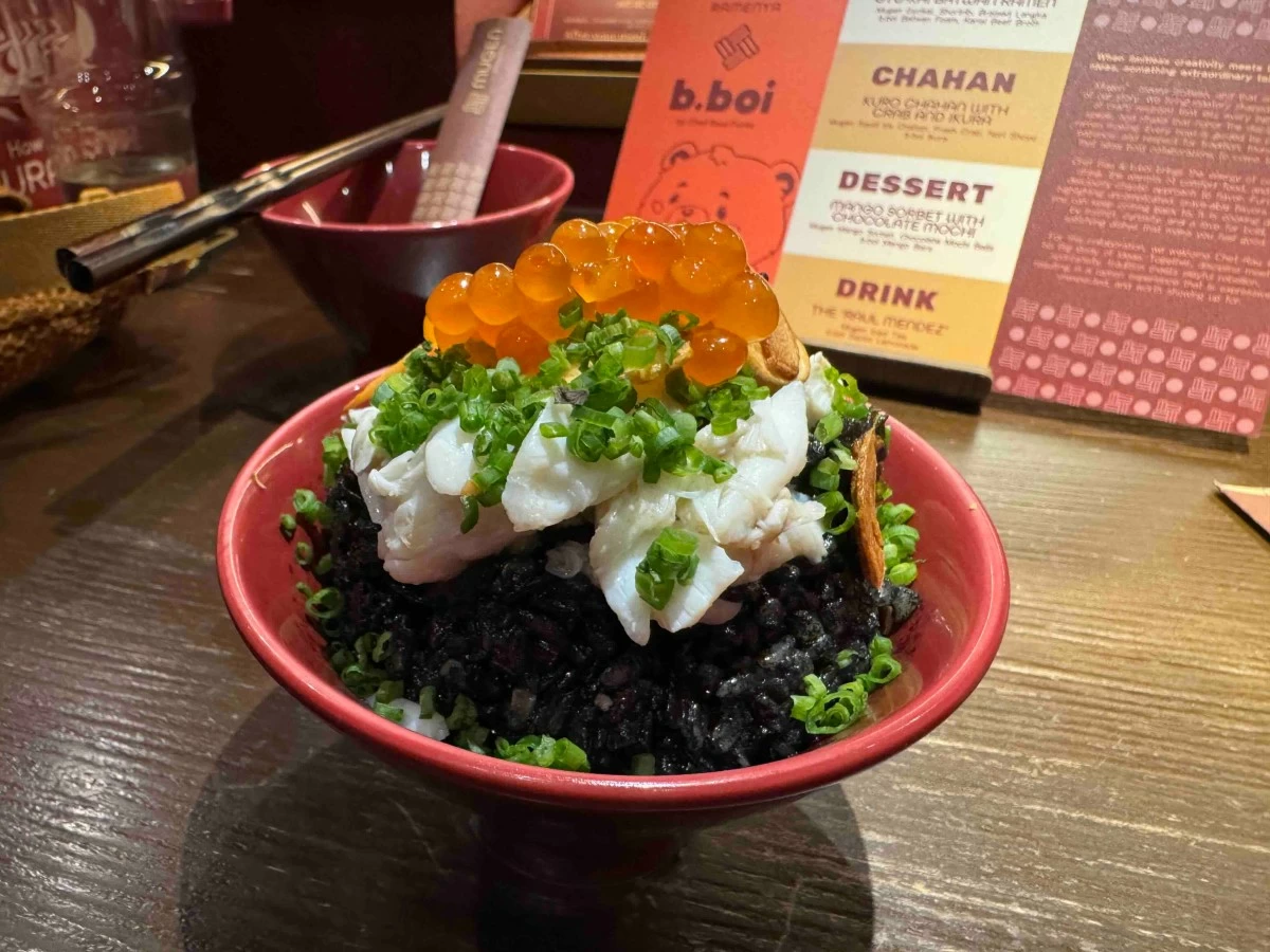 INKED GRAINS The Kuro Chahan with Crab and Ikura features squid ink Japanese fried rice topped with fresh crab, nori shoyu (Photo: Feliciano Rodriguez III)