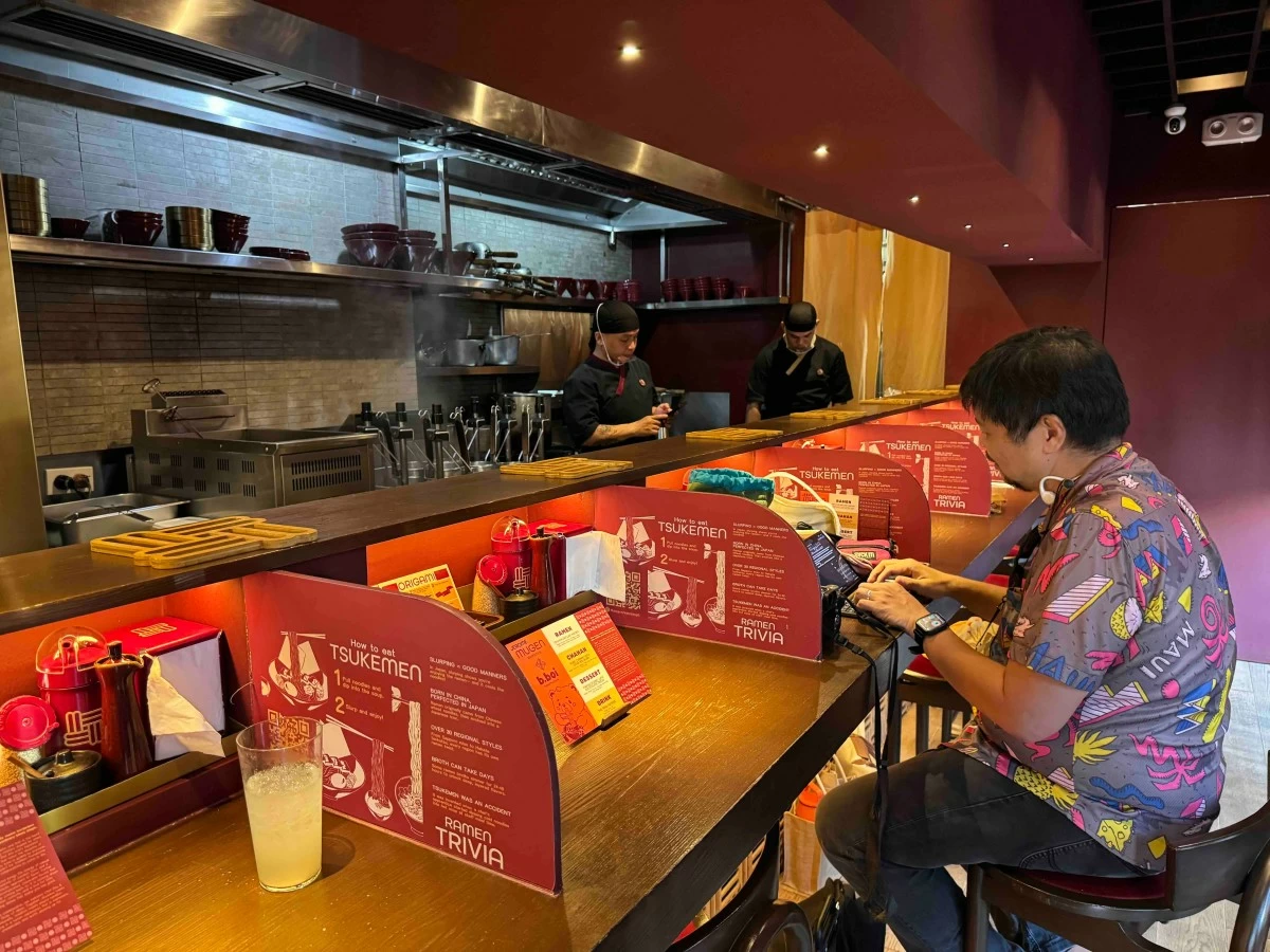 COUNTER CULTURE Inside Mugen Ramenya in Maginhawa, Quezon City, diners sit around the restaurant’s intimate L-shaped counter designed to mirror the compact ramen bars commonly found in Japan (Photo: Feliciano Rodriguez III)