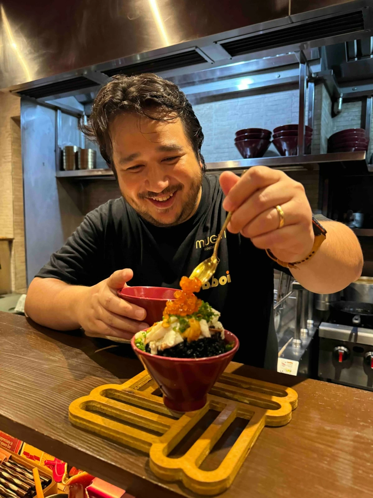 ROE SHOW Chef Raul Forés tops the Kuro Chahan with Crab & Ikura with generous spoonfuls of ikura during the launch of his collaboration menu with chef Jorge Mendez at Mugen Ramenya in Quezon City (Photo: Feliciano Rodriguez III/Manila Bulletin)