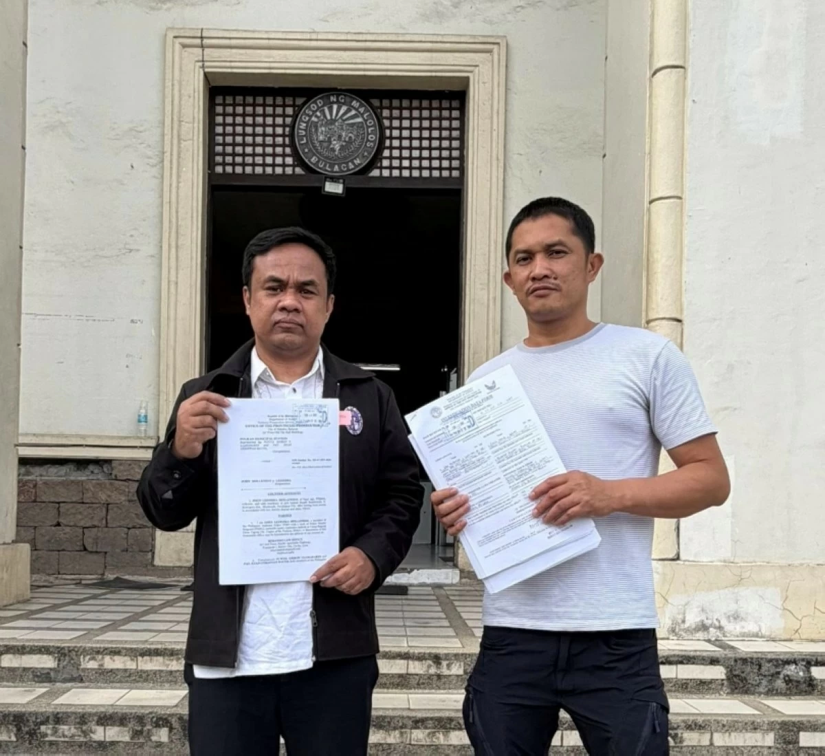 Police Senior Master Sergeant John Mollenido (right) with his lawyer, Cristobal Rimando (Photo from Rimando Law Office’s Facebook account) 
