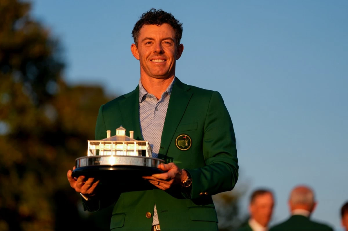 Rory McIlroy, of Northern Ireland, holds the trophy after winning the Masters golf tournament at the Augusta National Golf Club, Sunday, April 12, 2026, in Augusta, Ga. (AP Photo/Ashley Landis)