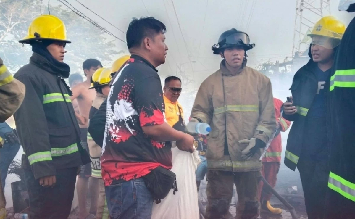 Authorities responding to the fire in Barangay New Lower Bicutan, Taguig on May 6 (Photo from the Barangay Disaster Risk Reduction Management Committee, Barangay New Lower Bicutan)

