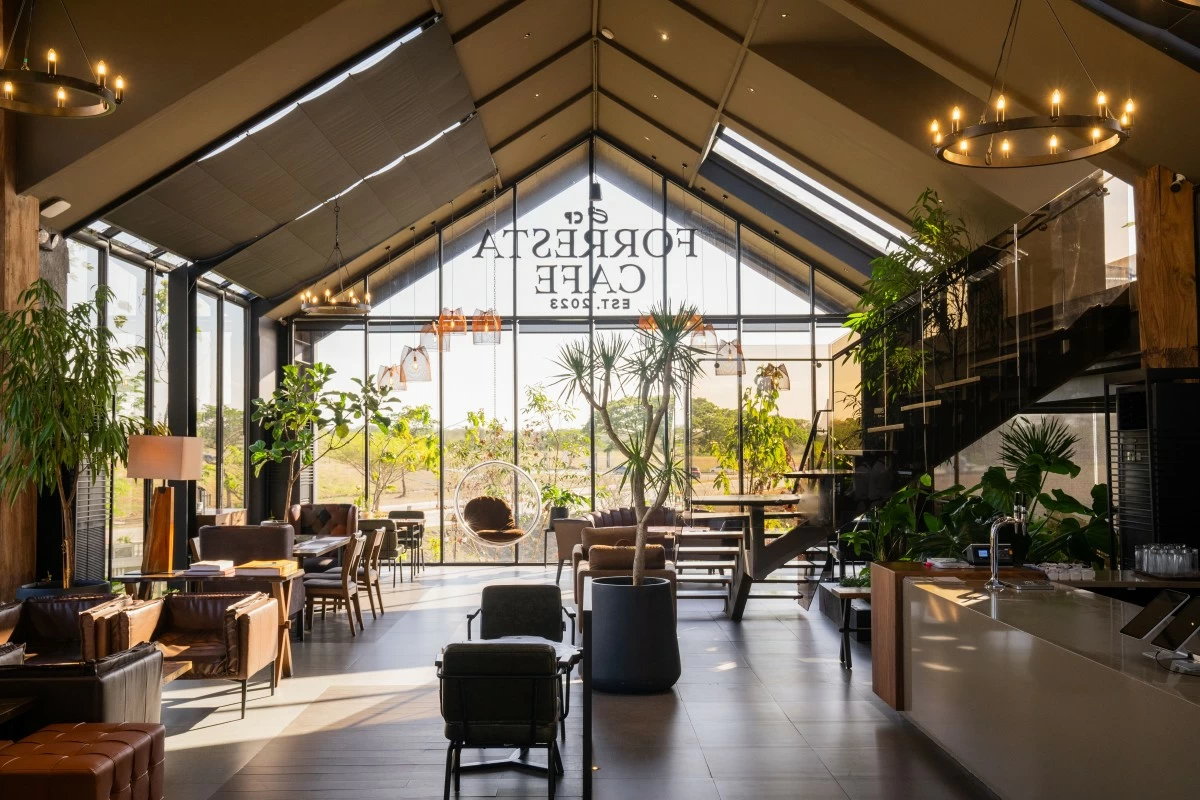 Nestled in lush greenery, Forresta Cafe offers a cozy, nature-inspired space perfect for dining and reconnecting. (Artist's perspective: Villar City)