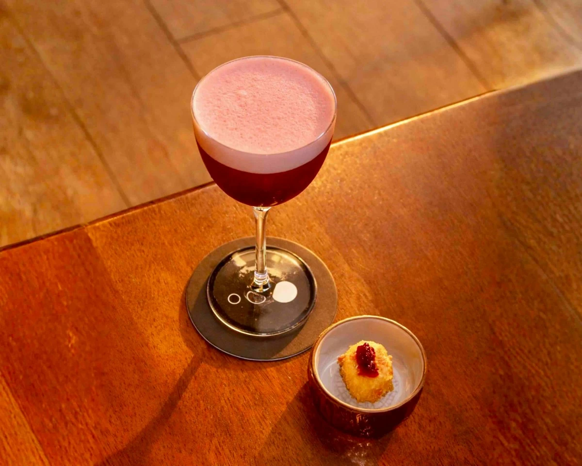 MODENA MEETS MARTINI Mamma Mia Modena brings together gin, strawberries, balsamic vinegar, espresso liqueur, chocolate bitters, and goat cheese in a cocktail inspired by charcuterie flavors and the Italian city of Modena. (Photo: Three Dots)