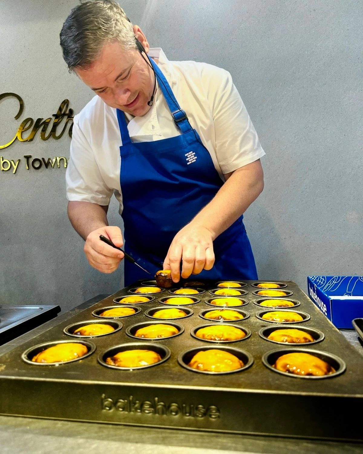 Greg teaches how to make his signature egg tarts during a workshop