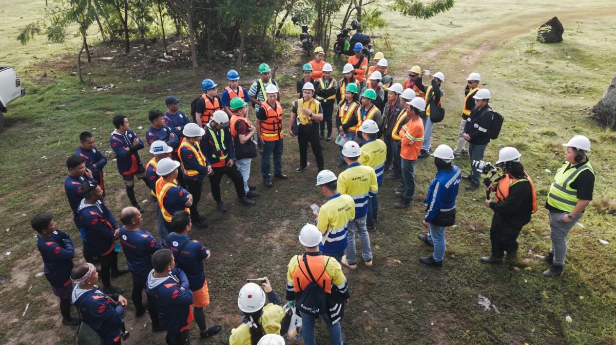 Engineers and project team members conduct a safety toolbox meeting before the critical task of connecting Samal to the mainland grid. 
