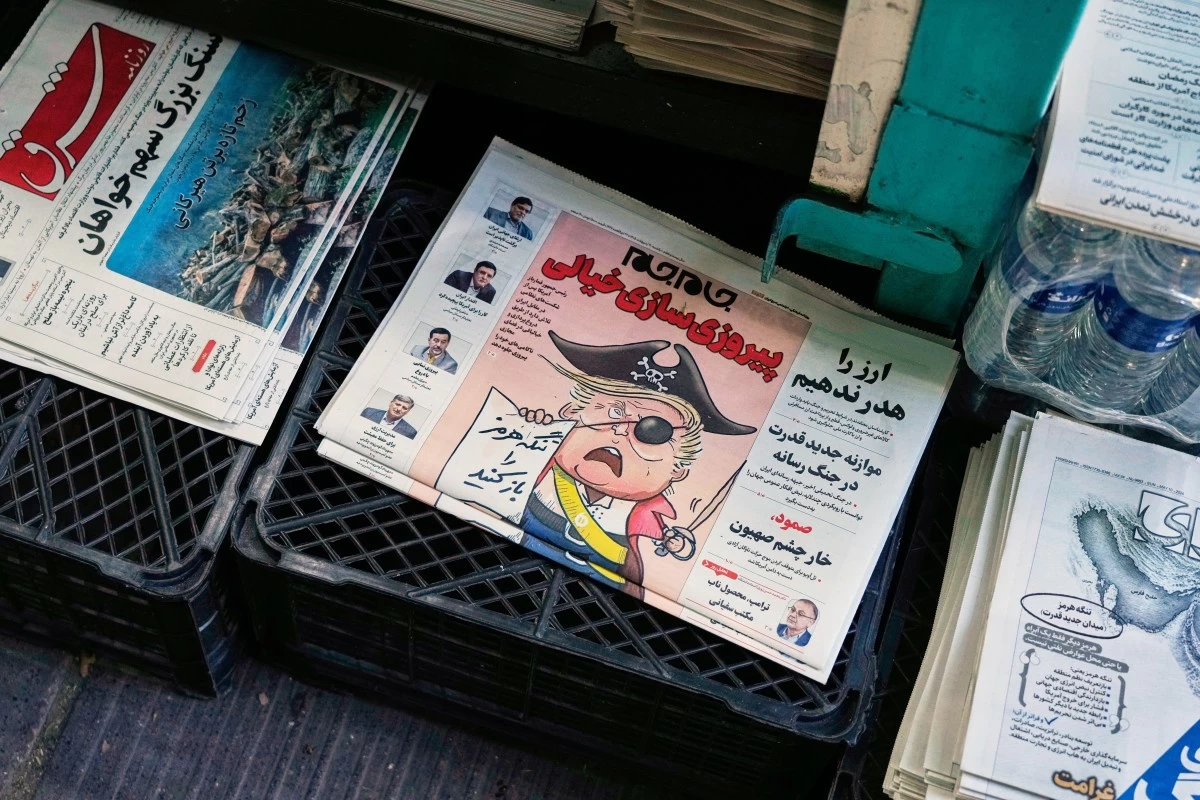 The front page of the Sunday May 10, 2026, edition of Iranian newspaper, Jamejam, is seen with a cartoon satirizing the U.S. President Donald Trump that asks: 
