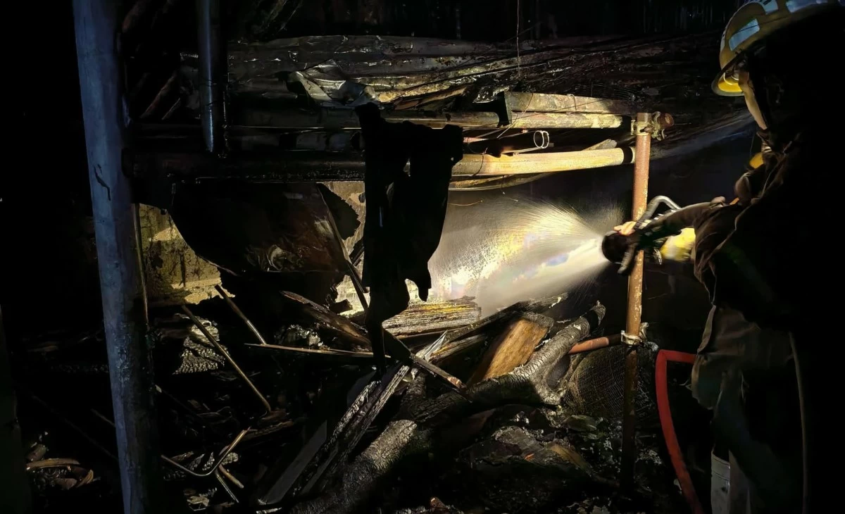 Fire engulfs an employees’ barracks of a junk shop in Barangay Gulod, Novaliches, Quezon City shortly after midnight on Monday, May 11. (Photo courtesy of Knights Fire and Rescue Volunteers Inc.)
