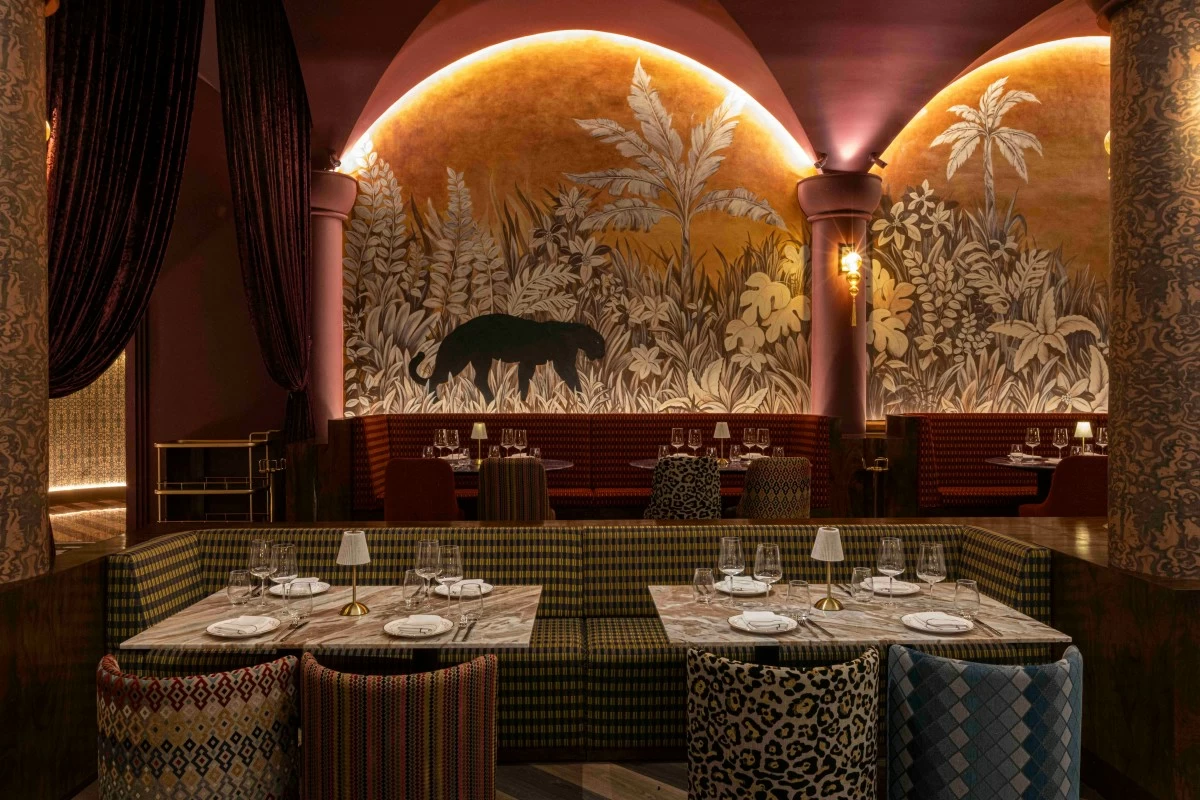 SAFARI NOIR Safari Moderne-inspired murals and moody interiors give Medusa its distinct blend of tropical glamour and after-hours sophistication. (Photo: Medusa)