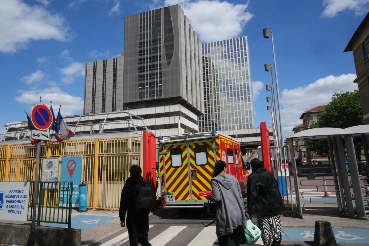 An ambulance enters the Bichat Hospital where a woman who tested positive for hantavirus remains in intensive care, in Paris, Tuesday, May 12, 2026. (AP Photo/Michel Euler)