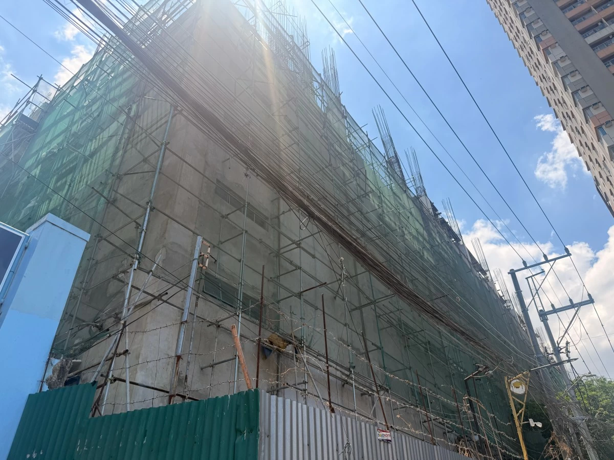 The 10-storey Ramon Magsaysay High School building along España Boulevard in Sampaloc, Manila is seen under construction, with completion targeted by February 2027.
