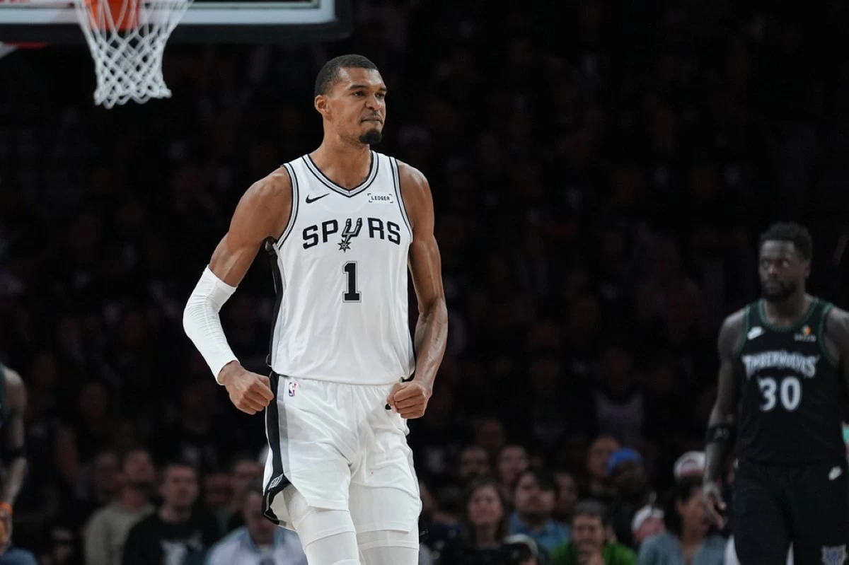 San Antonio Spurs forward Victor Wembanyama (1) reacts after scoring against the Minnesota Timberwolves during the first half of Game 6 of an NBA basketball second-round playoffs series in Minneapolis, Friday, May 15, 2026. (AP Photo/Abbie Parr)
