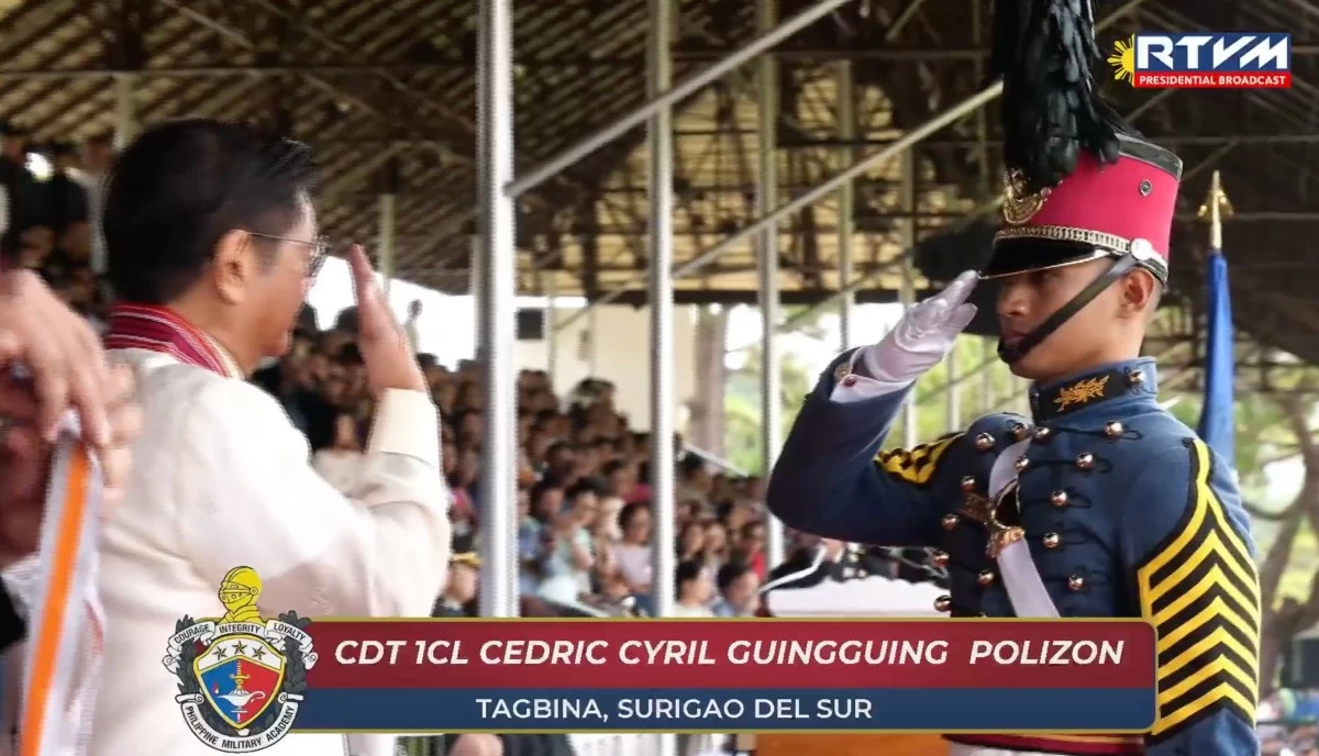 Aerocadet First Class Cedric Cyril G. Polizon (right) salutes at President Ferdinand Marcos Jr. during the graduation rites of the Philippine Military Academy Class of 2026 at Fort Gregorio del Pilar in Baguio City on May 16, 2026. Polizon ranked ninth in his class, which is composed of 207 cadets. (Courtesy of RTVM livestream)