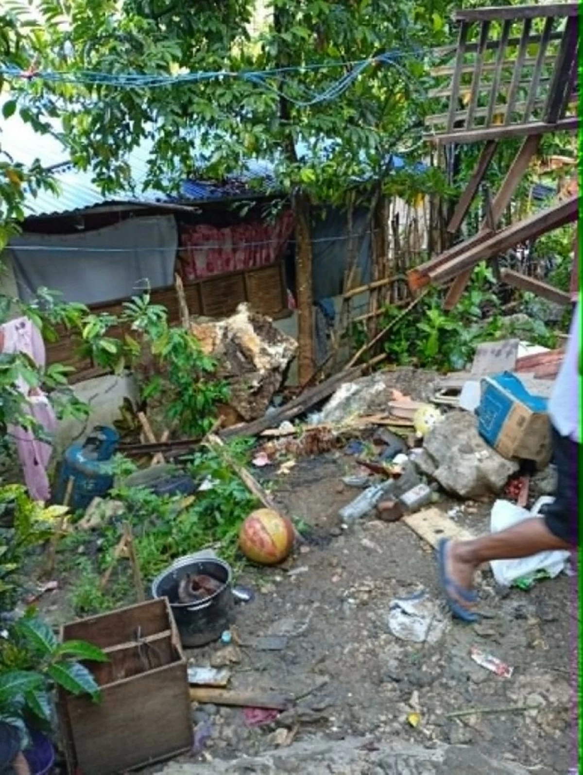 A portion of a house in Sitio Macopoy, Barangay Mascap, Rodriguez, Rizal was damaged after a large rock rolled down during a landslide incident on Saturday, May 17, leaving a woman dead and her two children injured. (Photo from Rodriguez Municipal Police Station)