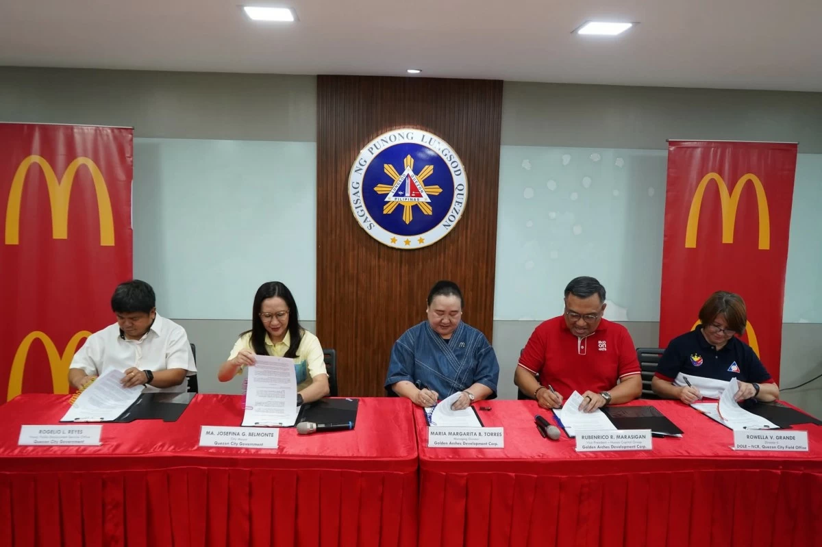 From left: Quezon City Public Employment Service Office (PESO) General Manager Rogelio Reyes, Quezon City Mayor Joy Belmonte, Golden Arches Development Corporation Managing Director Maria Margarita Torres, Vice President for Human Capital Group Ruben Marasigan, and Department of Labor and Employment (DOLE-NCR Quezon City Field Office) Director II Rowella Grande sign the memorandum of agreement on Monday, May 18, formalizing the employment of senior citizens. (Photo courtesy of the Quezon City Public Employment Service Office (PESO)