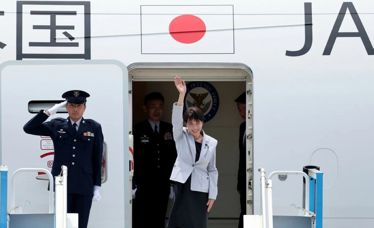 Japan's Prime Minister Sanae Takaichi waves upon arrival at the Daegu International Airport in Daegu, South Korea, Tuesday, May 19, 2026. (Yoon Kwan-shick/Yonhap via AP)