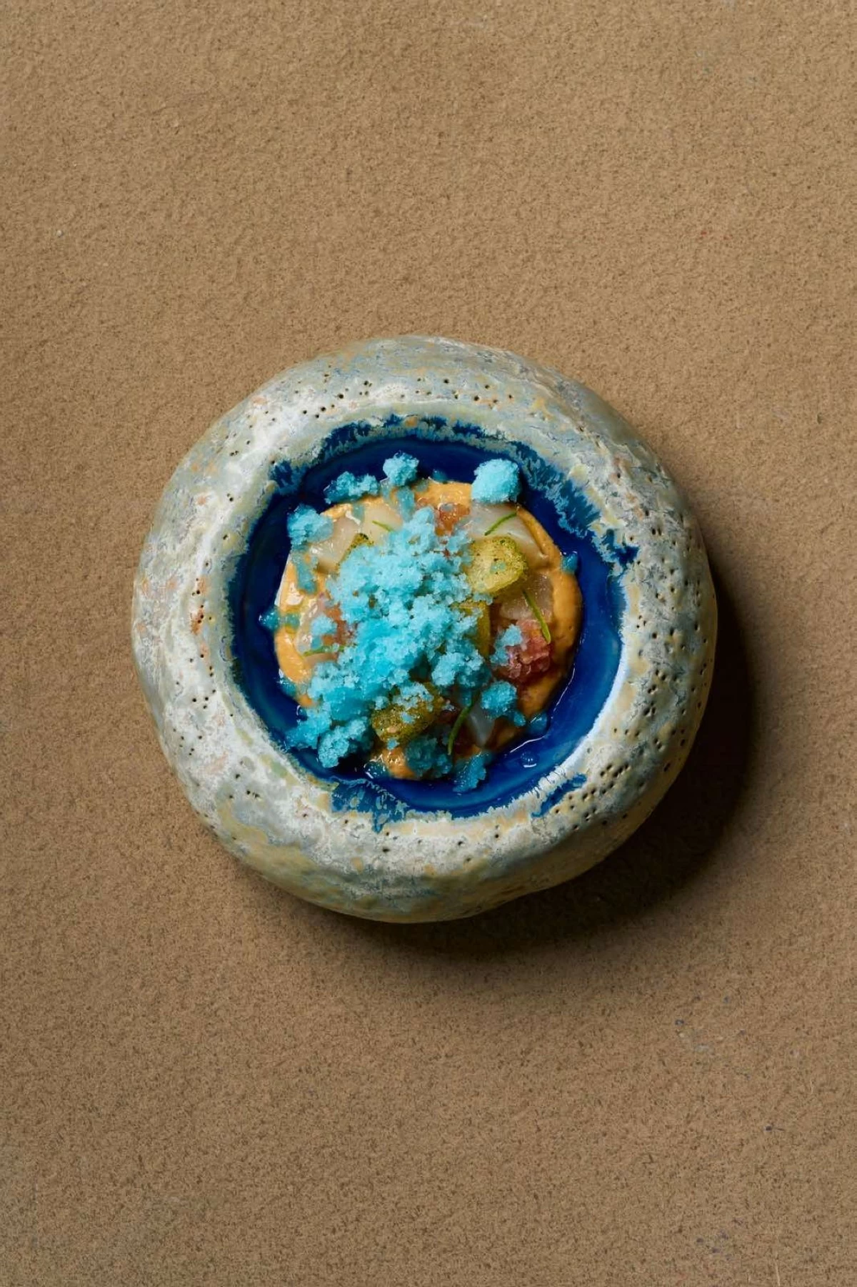 CITY TIDES 'Manila' pays homage to the capital as a melting pot, using an uni emulsion, scallops, cassava, and topped with granita made of citrus and local souring agents. (Photo: Fern Dy)