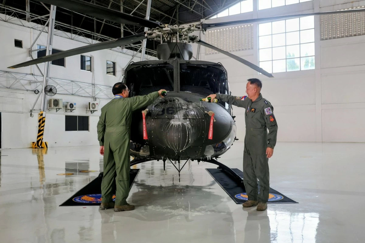 (L-R) Lt. Gen. Arthur M. Cordura, commanding general of the Philippine Air Force (PAF), and Major Gen. Moises L. Micor, commander of the Air Mobility Command, lead the ceremonial pouring of champagne on one of the two newly acquired Bell 412EPX helicopters on May 19, 2026 at Villamor Air Base in Pasay City. (Photo: PAF)