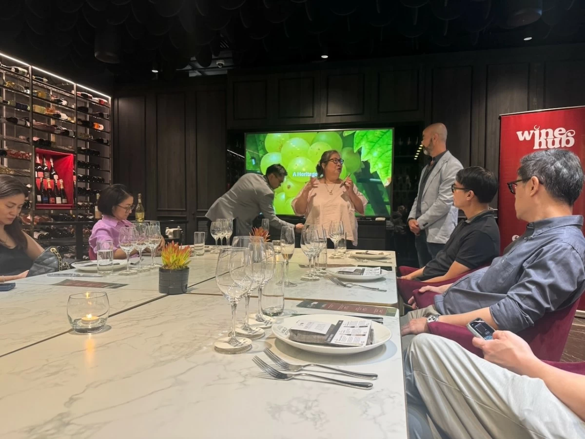 WINE NIGHT NOTES Food journalist and consultant CJ Juntereal joins Alessandro Mazzocco during a wine appreciation session at World Cellar inside World Kitchens at Gateway Mall 2 in Quezon City. (Photo: Feliciano Rodriguez III/Manila Bulletin)