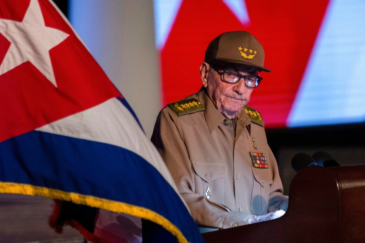 Former Cuban President Raul Castro looks at the Cuban flag during his speech at the event celebrating the 65th anniversary of the triumph of the revolution in Santiago, Cuba, Jan. 1, 2024. (AP Photo/Ismael Francisco, File)