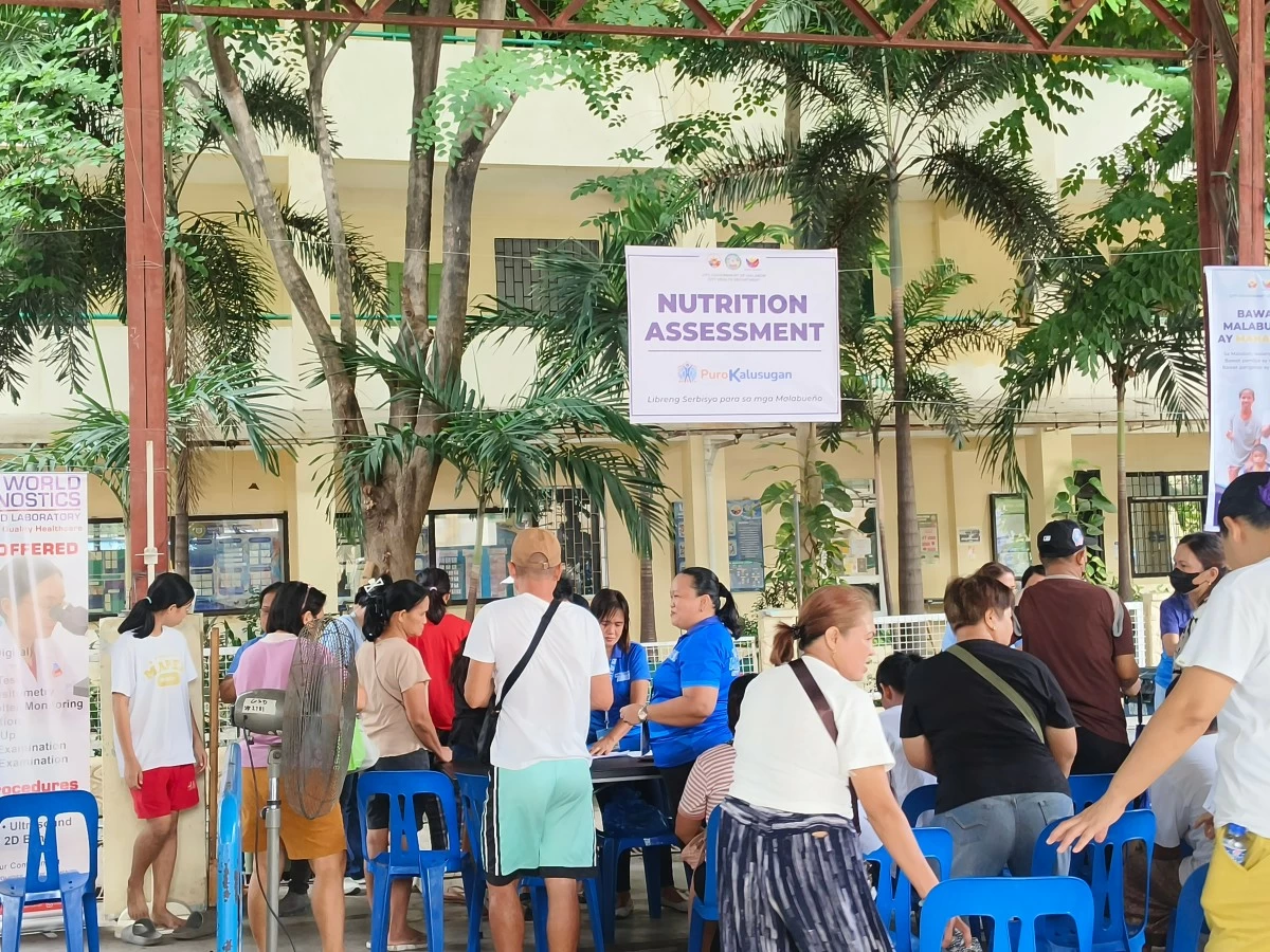 Residents line up for free services during the Walang Tulugan Serbisyo Caravan in celebration of Malabon City’s 427th Founding Anniversary on Thursday, May 21. (Photo by Hannah Nicol/MANILA BULLETIN)