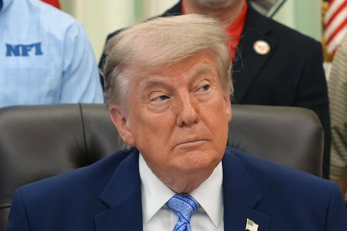 President Donald Trump attends an event about loosening a federal refrigerant rule, in the Oval Office at the White House, Thursday, May 21, 2026, in Washington. (AP Photo/Jacquelyn Martin)