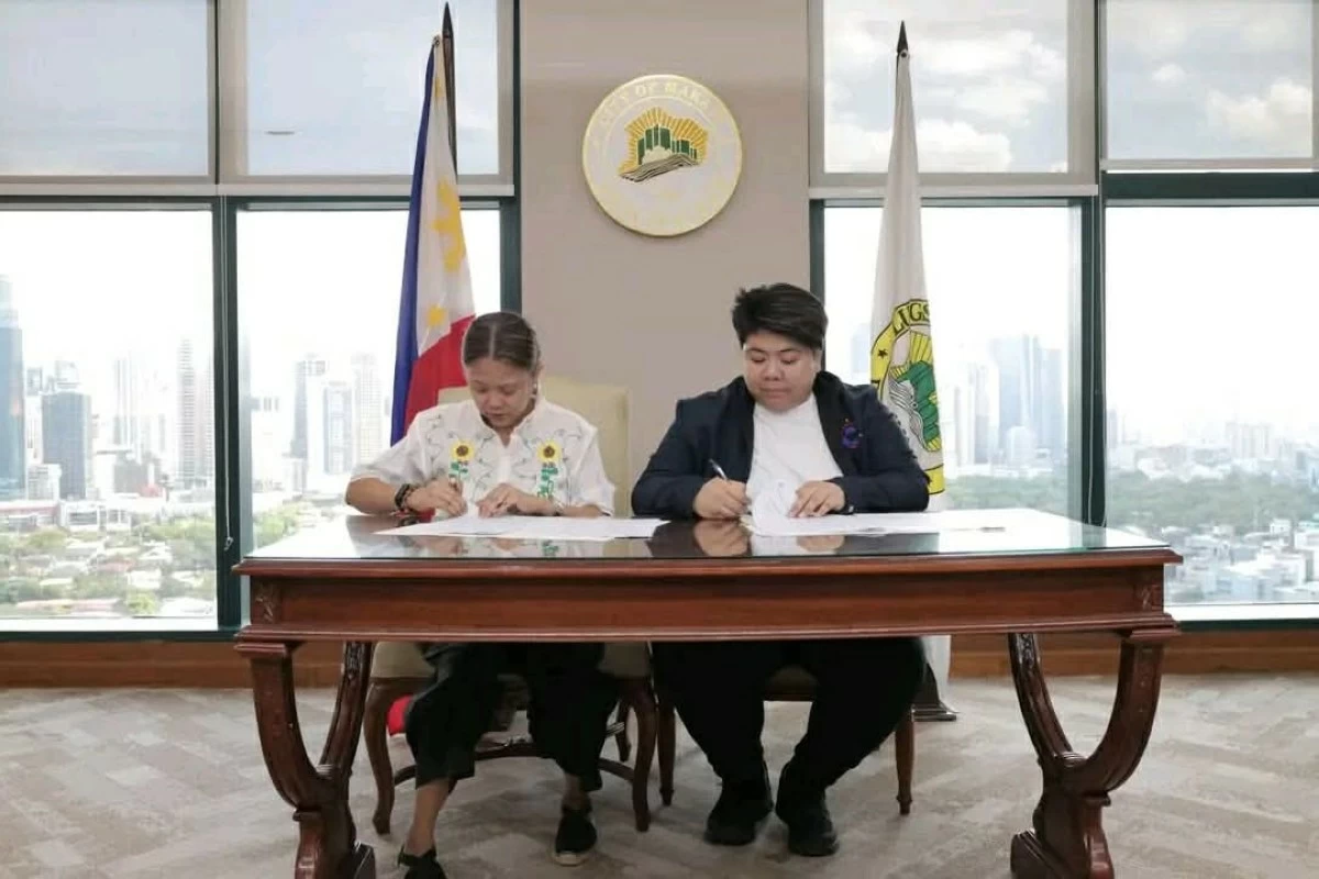 Makati Mayor Nancy Binay, together with Overseas Workers Welfare Administration (OWWA) Administrator PY Caunan, signs a Memorandum of Agreement to enhance support for overseas workers and their families. (Photos from My Makati)
