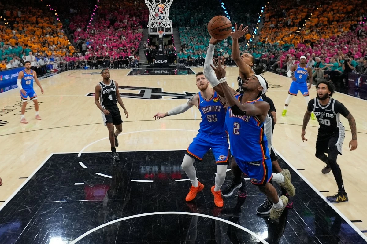 Oklahoma City Thunder guard Shai Gilgeous-Alexander (2) shoots during the first half of Game 3 in the Western Conference finals NBA basketball playoffs series against the San Antonio Spurs Friday, May 22, 2026, in San Antonio. (AP Photo/Darren Abate)