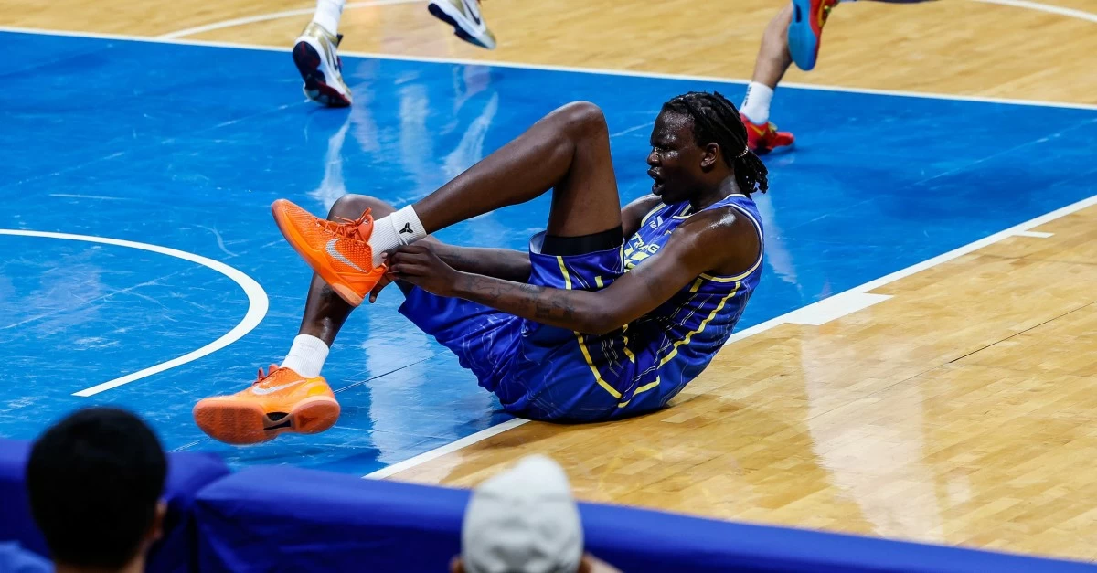 TNT's Bol Bol winces in pain during Game 2 of their PBA semifinals series against Meralco. (PBA Images)