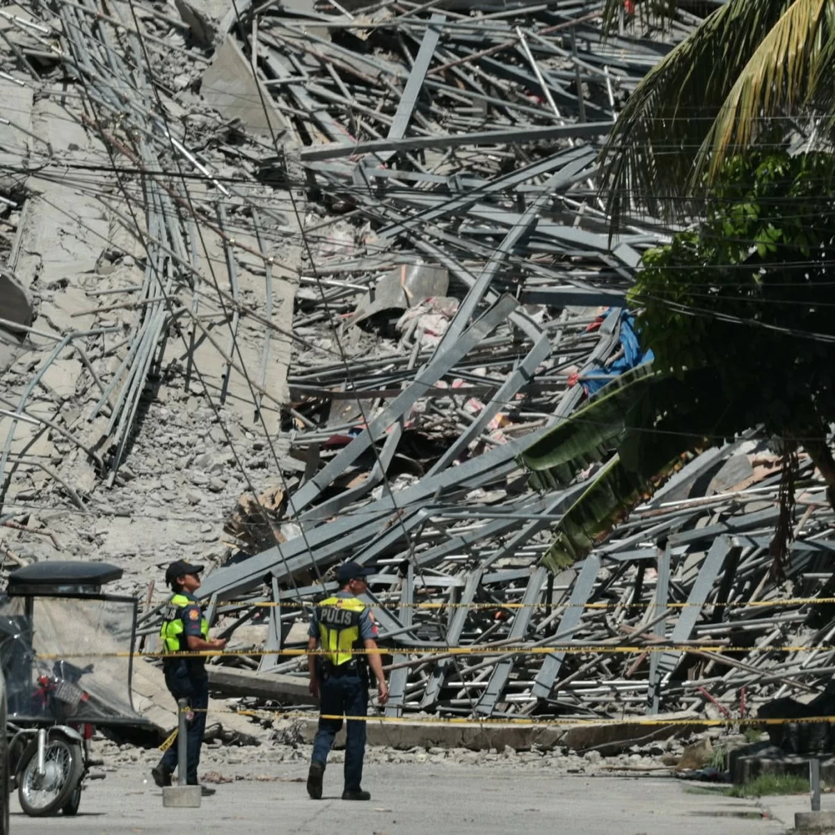A multi-storey building collapsed in Barangay Balibago, Angeles City, Pampanga on Sunday, May 24, 2026. Authorities have yet to confirm the number of casualties, but residents near the site and workers reported that around 30 to 40 people are still trapped beneath the collapsed structure. (Photos by Santi San Juan)