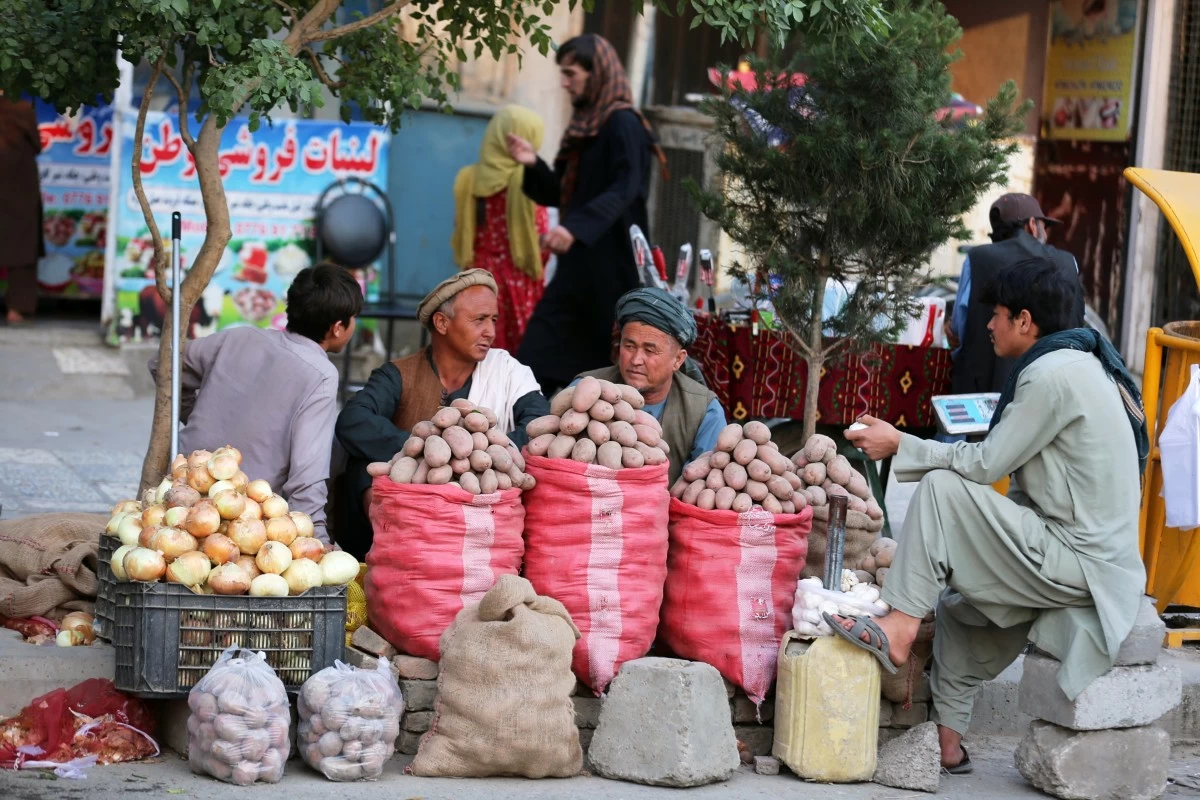 Vendors sell potatoes at their stall in a street market in Kabul, Afghanistan, Thursday, May 14, 2026. (AP Photo/Siddiqullah Alizai)