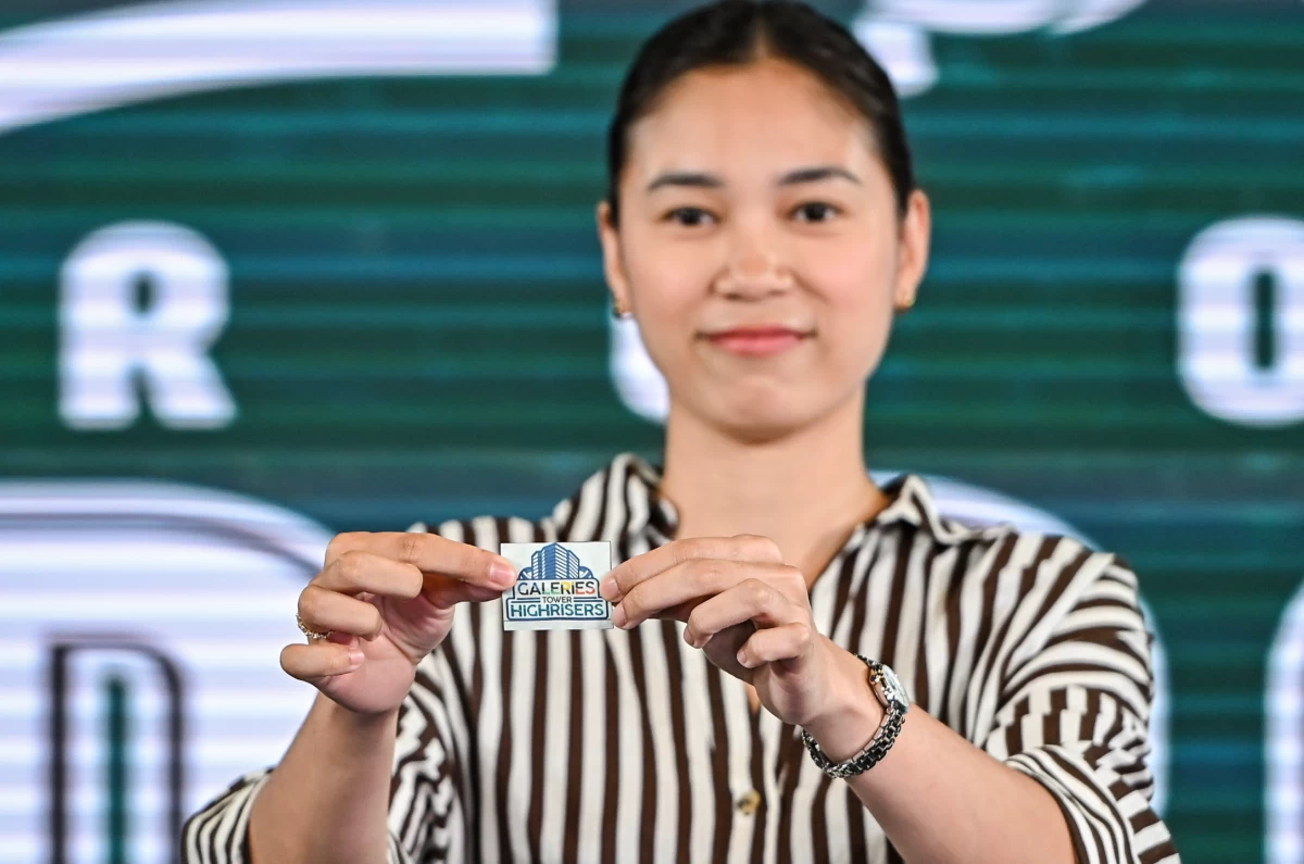 PLDT"s Mika Reyes shows the name from the lottery. (PVL Images)