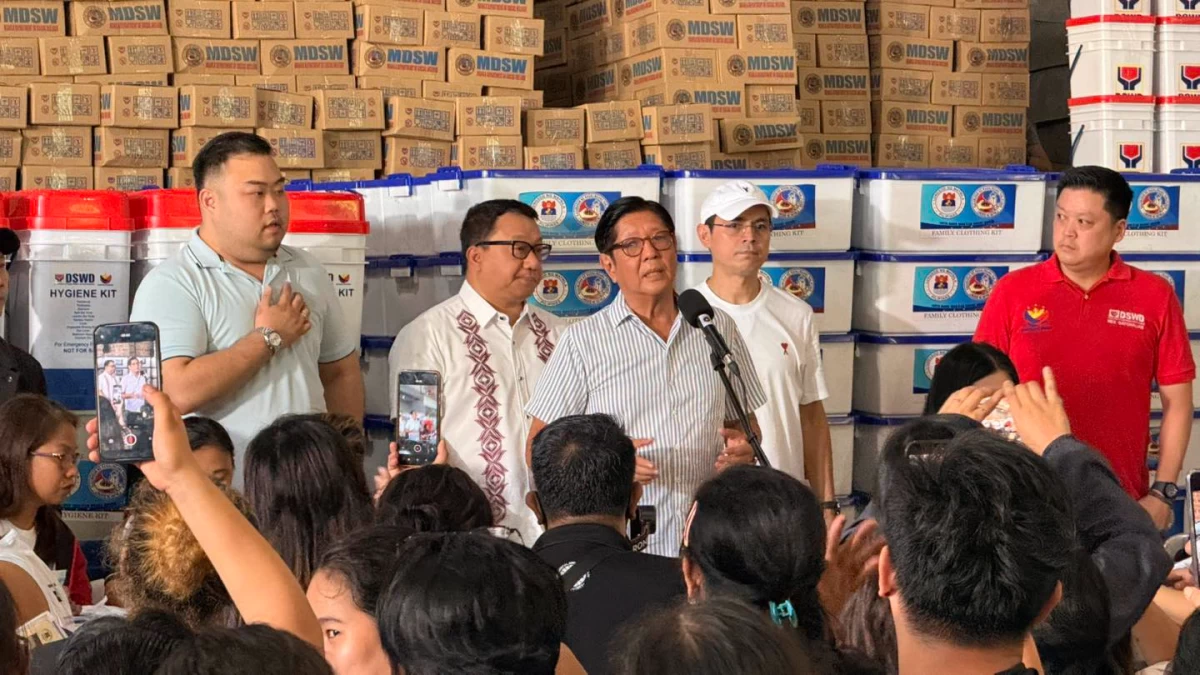 President Ferdinand R. Marcos Jr. addresses fire victims at the Delpan Evacuation Center as Manila Mayor Francisco 