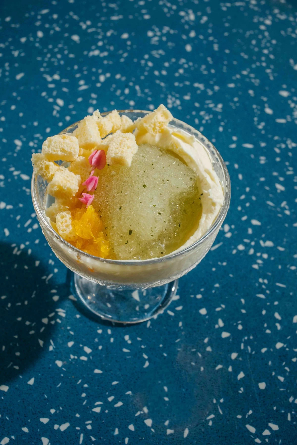 CITRUS CHILL The Calamansi Coconut Granita delivers a refreshing finish with calamansi crémeux, dried sponge cake, and orange ferment (Photo: Arabella Paner)