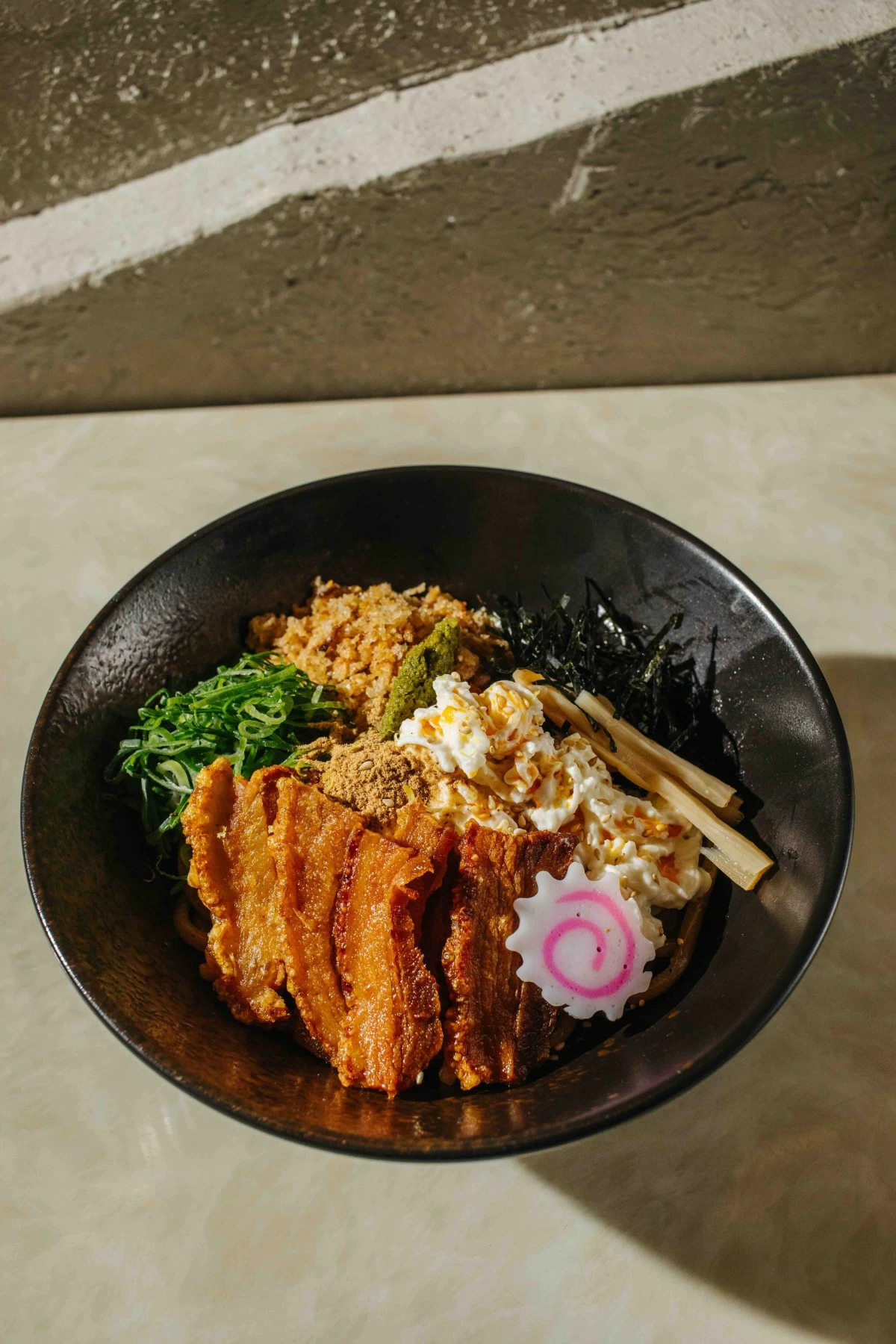 NOODLE SIN The Crispy Pork Abura Soba pairs bagnet, stracciatella, calamansi kosho, and menma for a rich but balanced noodle dish (Photo: Arabella Paner)
