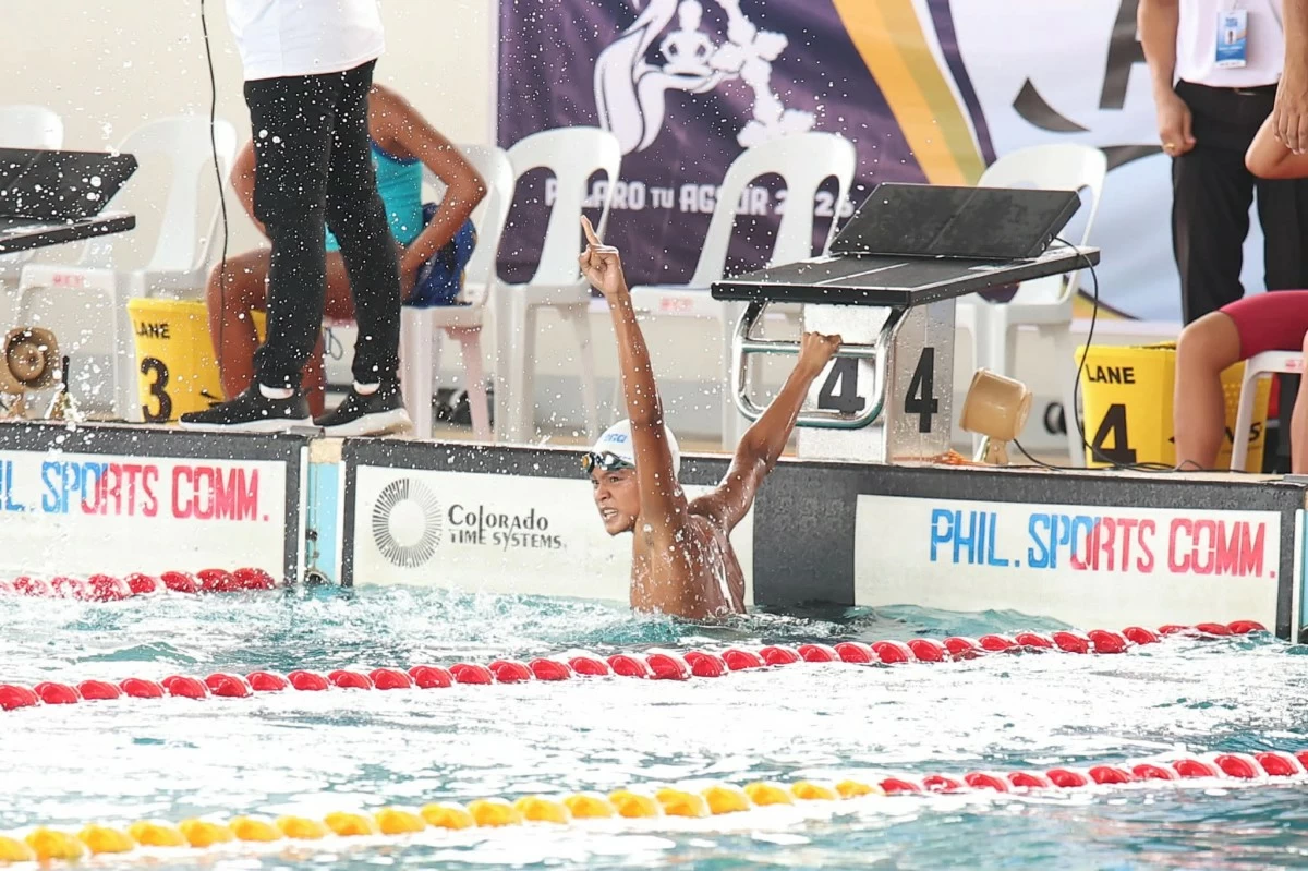 CHARLES NATHAN Boneo celebrates his record-breaking gold medal.