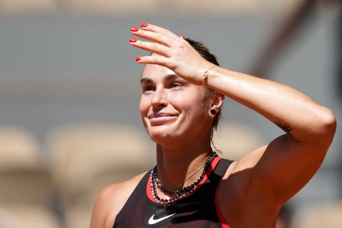 Aryna Sabalenka of Belarus celebrates after winning against Jessica Bouzas Maneiro of Spain during their first round women's singles tennis match at the French Open tennis tournament in Paris, Tuesday, May 26, 2026. (AP Photo/Christophe Ena)