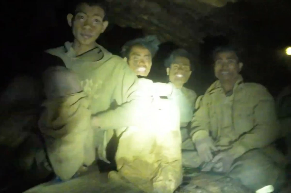 
IMAGE made from video provided by Benz Norrased Palasing Seascout Diving shows the villagers who were trapped and found in a flooded cave in Xaisomboun province, Laos, Wednesday, May 27, 2026. (Benz Norrased Palasing Seascout Diving via AP)
