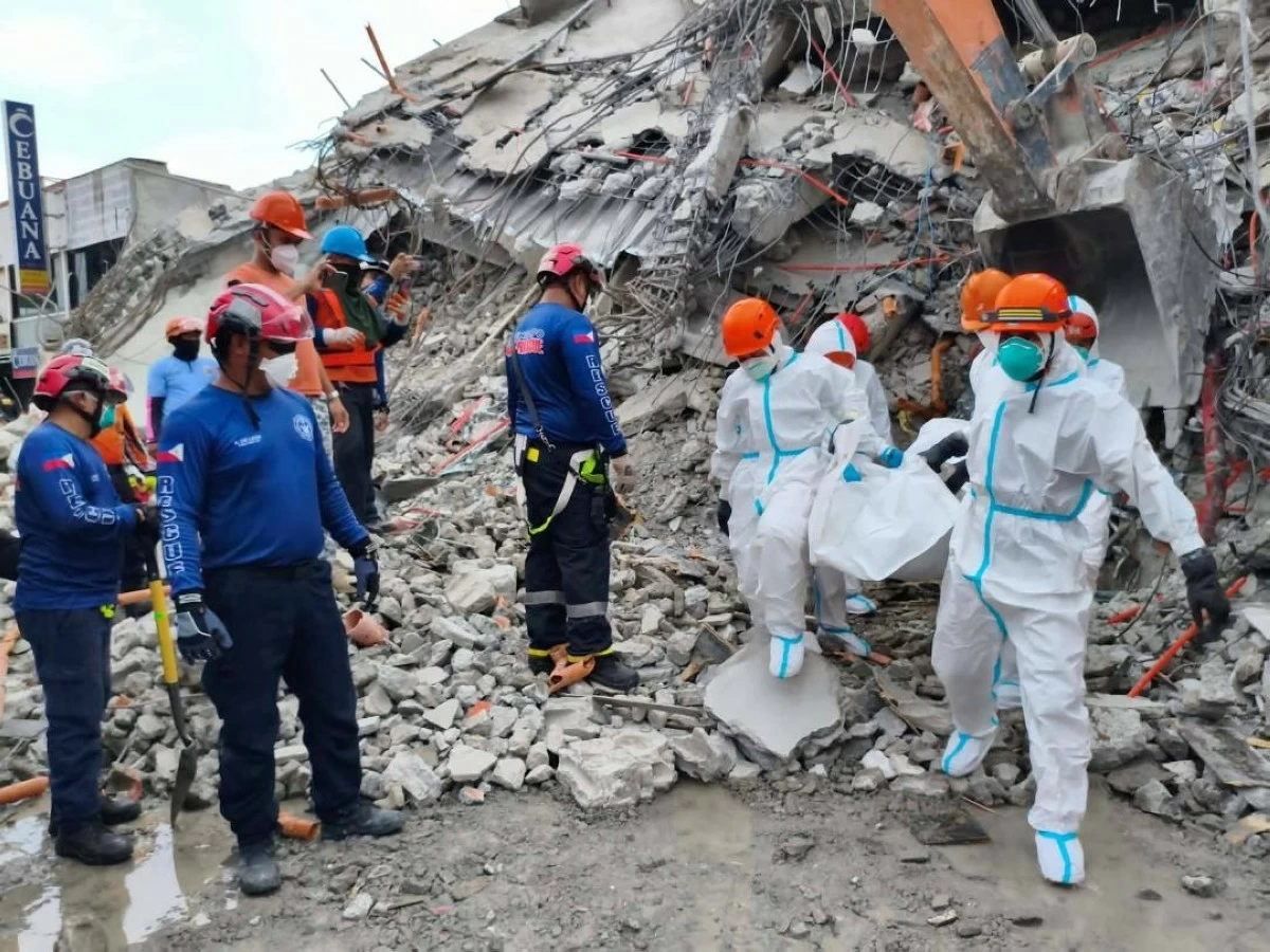 ONE of the bodies  recovered from the collapsed building in Angeles City on Sunday. (Photo via Liezle Inigo)