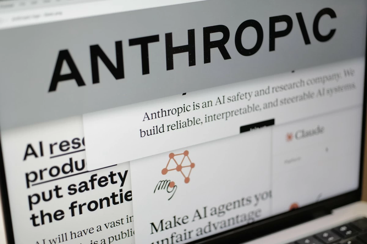 FILE - Pages from the Anthropic website and the company's logo are displayed on a computer screen in New York, Feb. 26, 2026. (AP Photo/Patrick Sison, File)