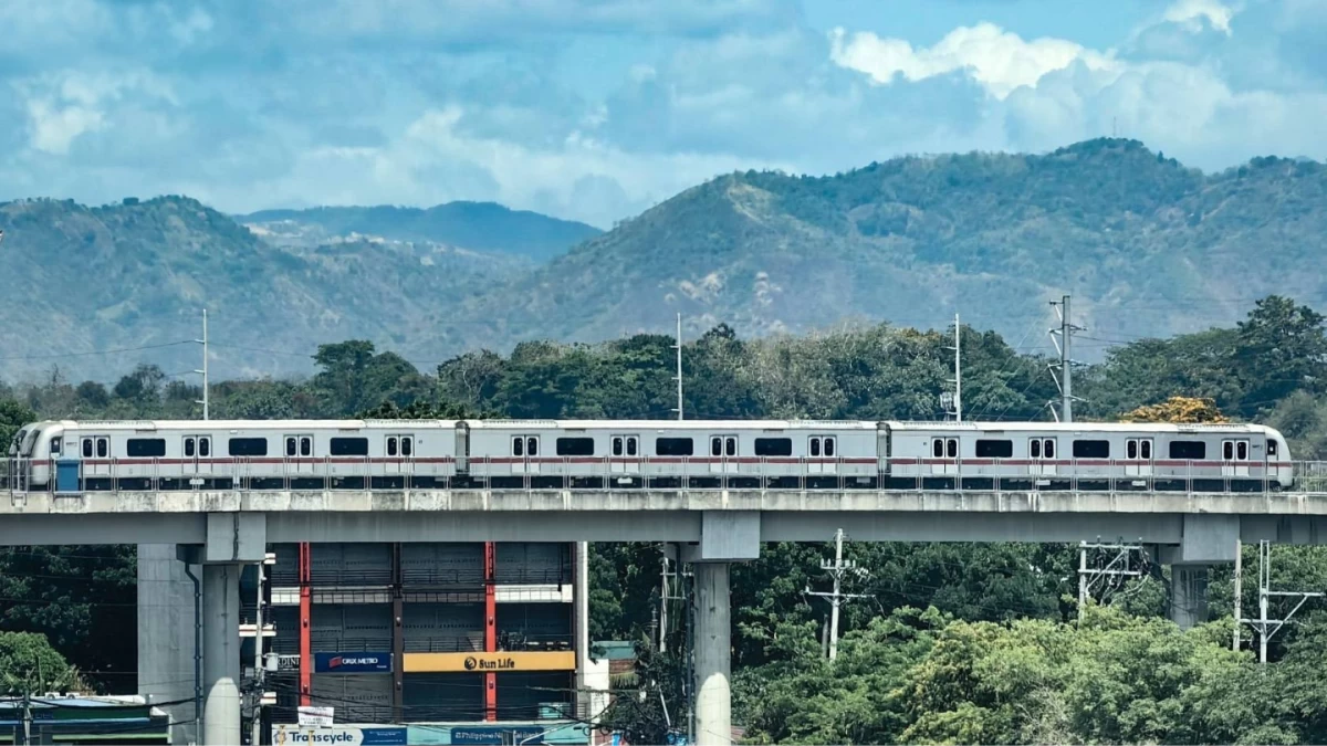 A Metro Rail Transit Line 7 (MRT-7) train sits on elevated tracks against the backdrop of the Sierra Madre mountain range in Quezon City on Saturday, May 2, 2026. The ₱77-billion mass-transit project has surpassed 80 percent completion, with authorities targeting partial operations for its initial stations by the second quarter of 2027 to ease severe traffic congestion along Commonwealth Avenue. (Photo by Santi San Juan I Manila Bulletin)