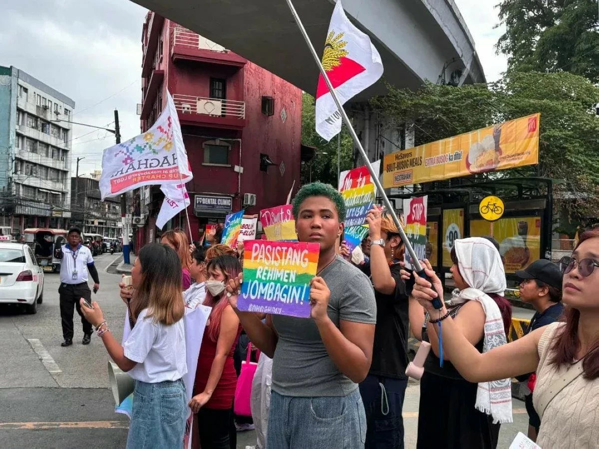 Members of the LGBTQ+ community carry placards as they stage a protest during the opening of Pride Month at Mendiola in Manila, calling for equal rights and the passage of the SOGIESC Equality Bill. (Photo courtesy of Bahaghari)