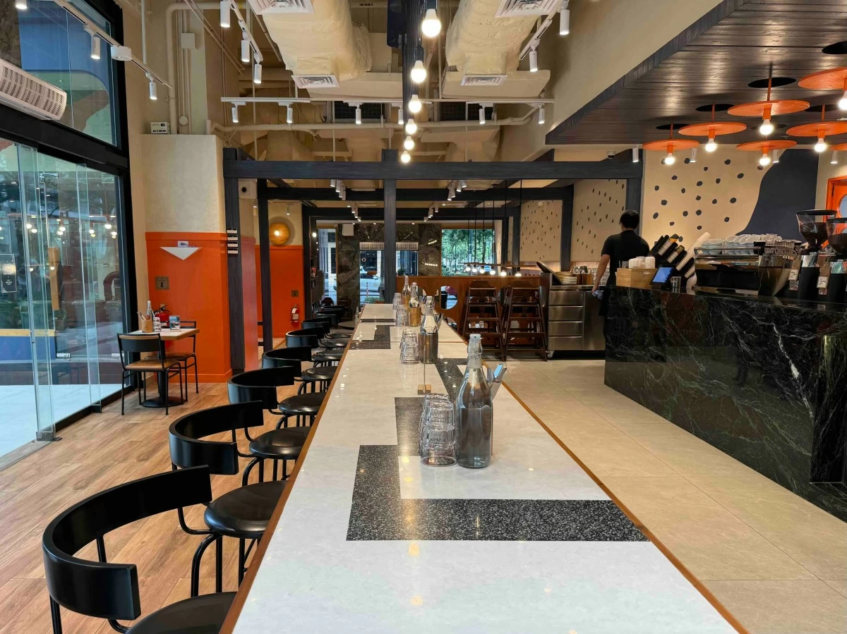 STAY AWHILE The bright, open interiors of Common Man Coffee Roasters in BGC are designed for everything from quick coffee breaks to long afternoons of work, conversation, and relaxation (Photo: CMCR)