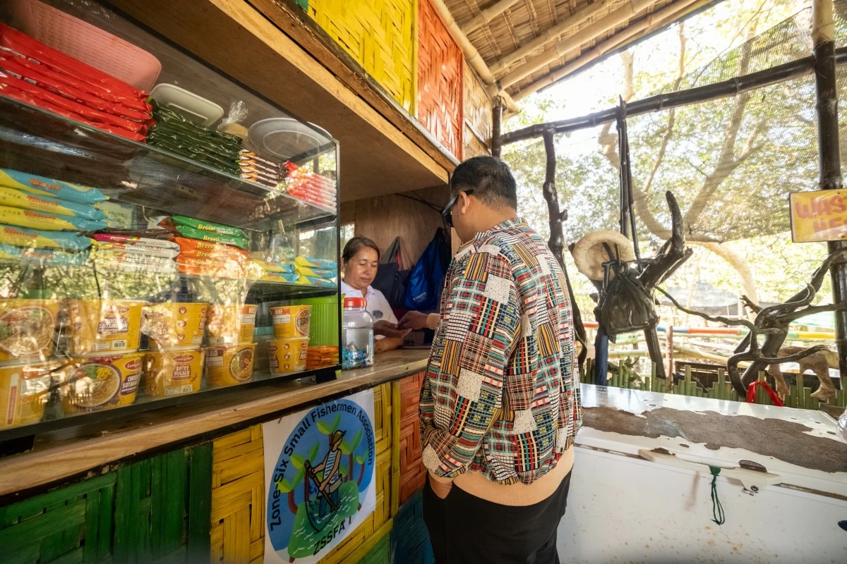 ZSSFA manages a community-built boardwalk that includes a sari-sari store, a canteen, and a modest entrance fee that supports mangrove planting.