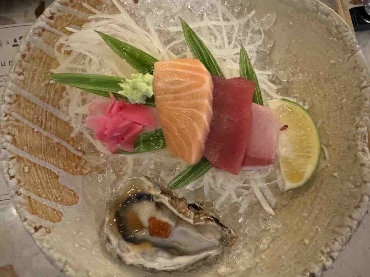 FROM THE SEA A seafood course featuring sashimi selections of hamachi, shake, and tuna, alongside Hiroshima Oyster Pinakurat, temaki, and nigiri topped with kingsu, madai, and shima aji. (Photo: Feliciano Rodriguez III/Manila Bulletin)