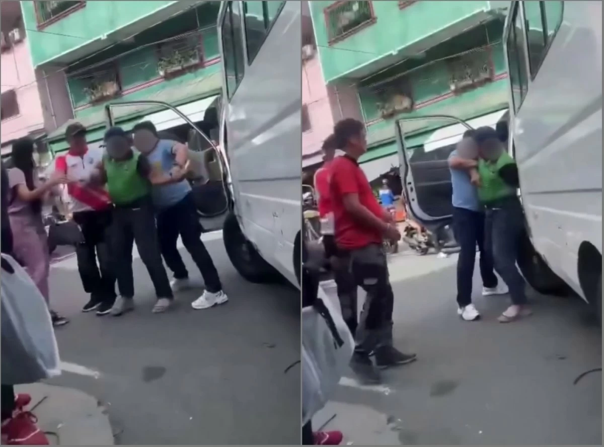 A police officer trying to handcuff the driver in Taguig (Screenshots from Tenants Ray Rice video on Facebook)