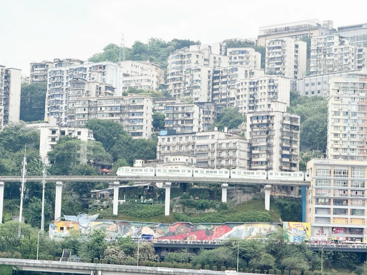 LIZIBA LIGHT RAIL STATION is a popular tourist spot because it features a light rail train passing through an apartment building. 